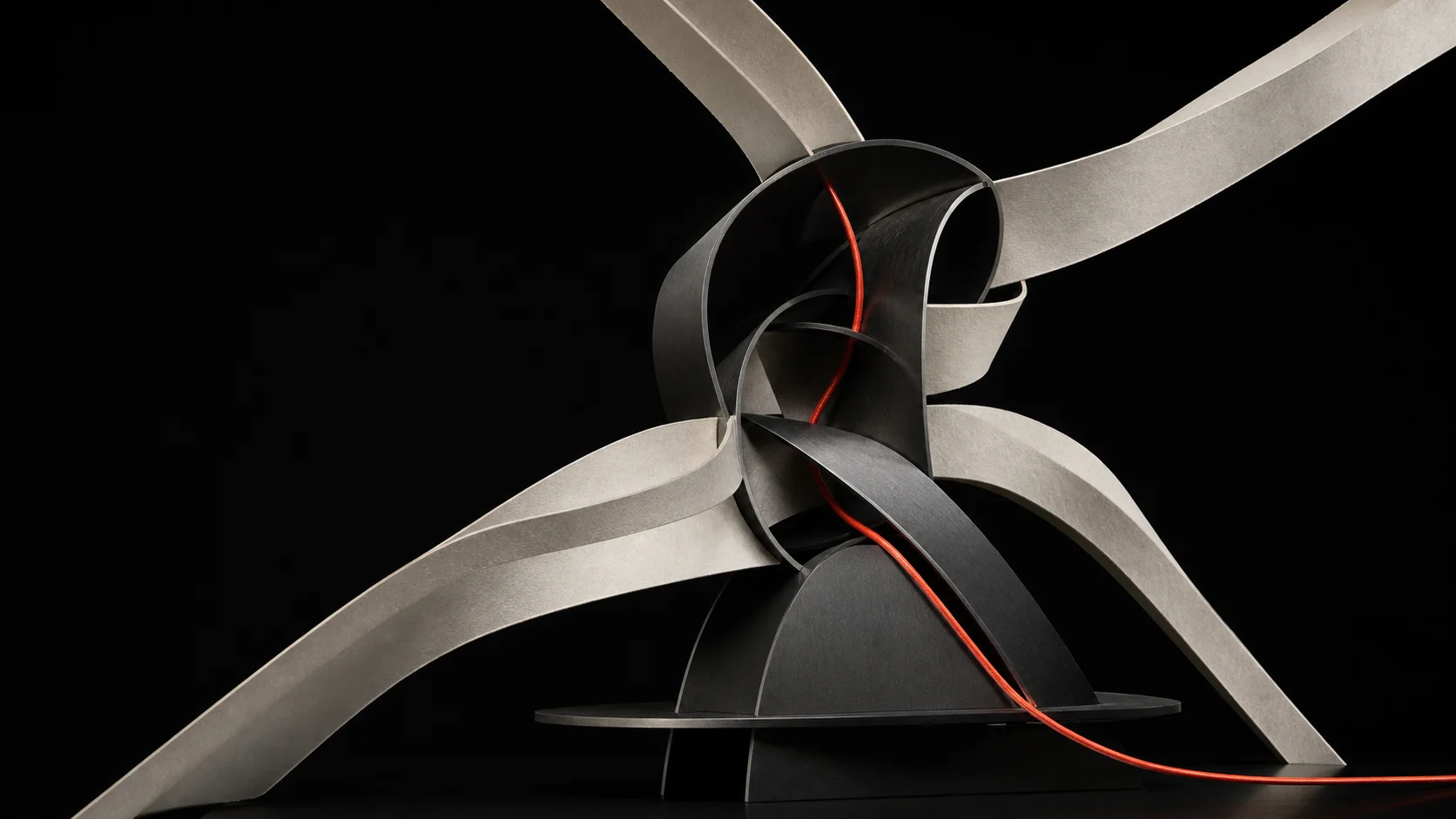 Sculptural paper and metal streams converging around a coral signal cord